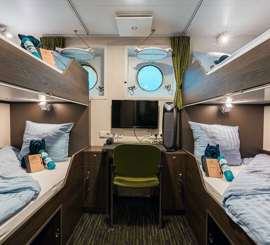 Four person cabin with portholes © ship ortelius
